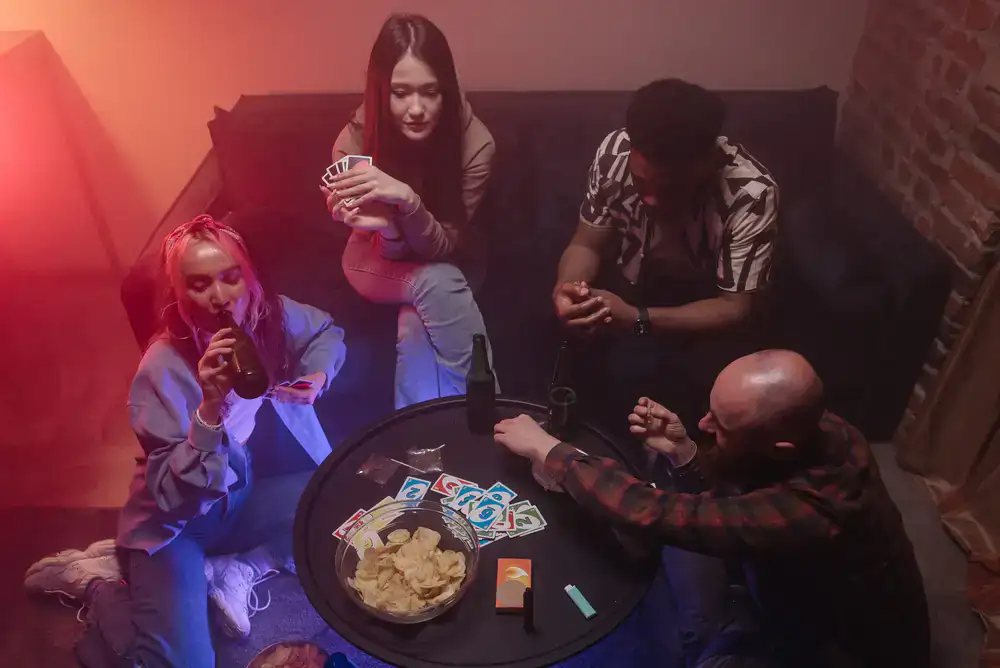 A group of friends laughing while playing a party game