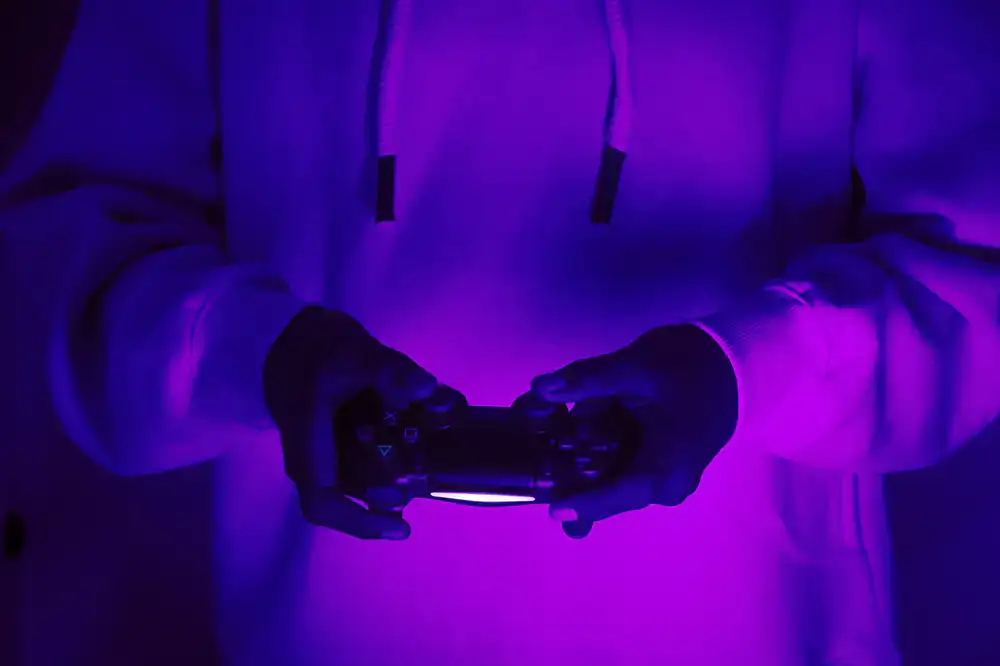 Player enjoying a shake while holding a console controller
